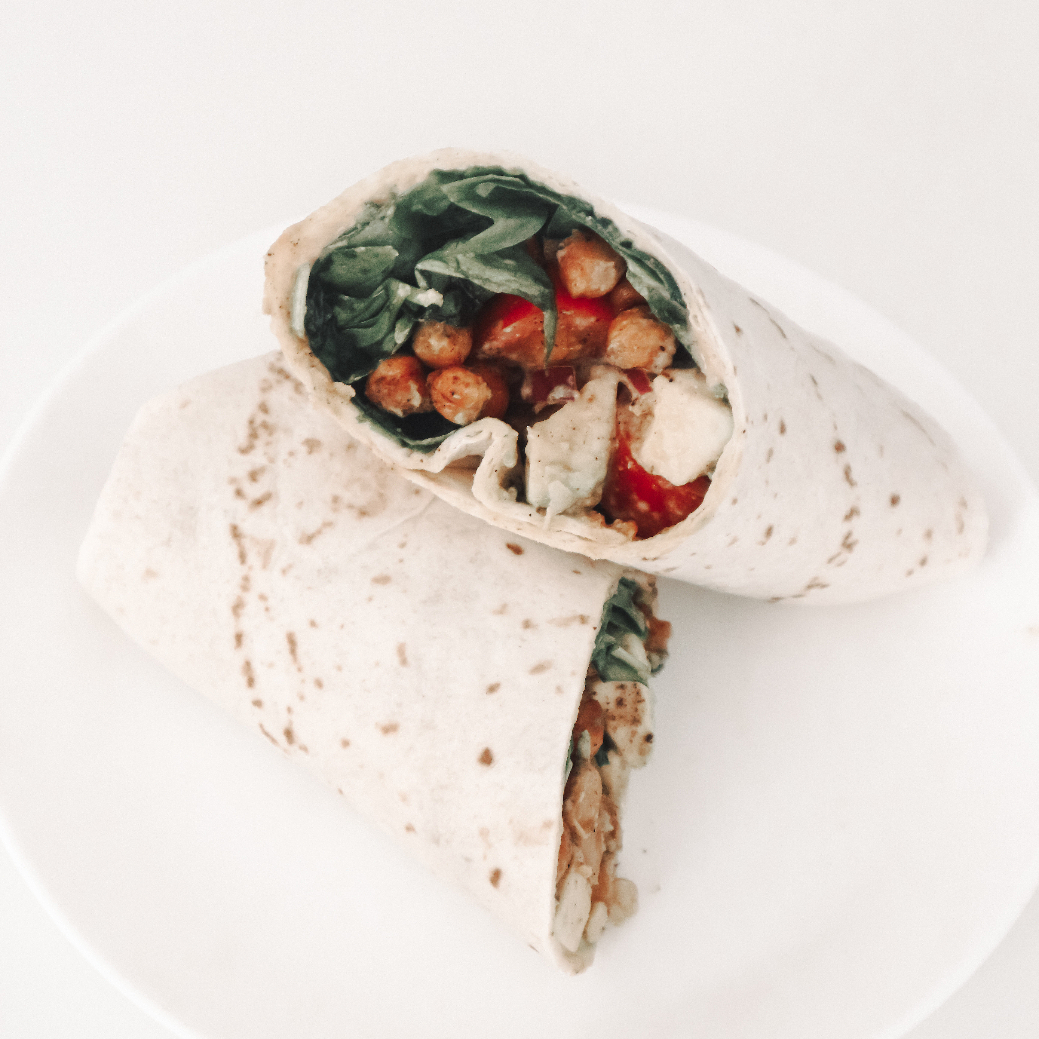 Vegan wrap with spinach, chickpeas and avocado.